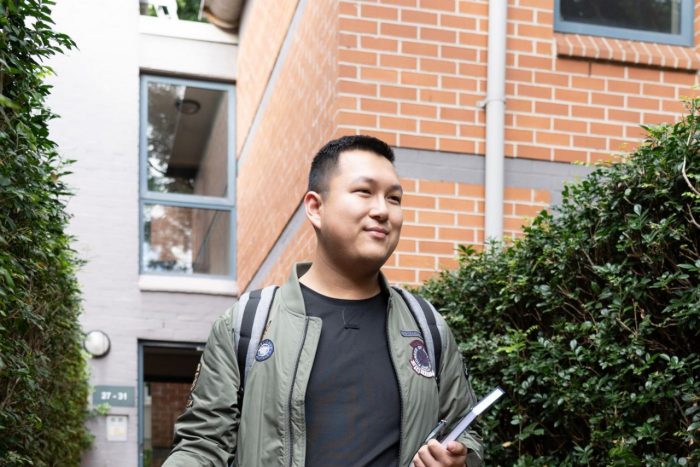 UNSW Cowper St apartments student shown walking through entrance