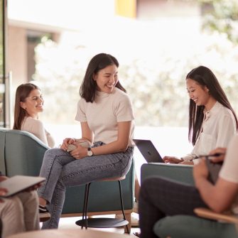 Students relaxing and studying in the common lounge at UNSW Kensington accommodation.
