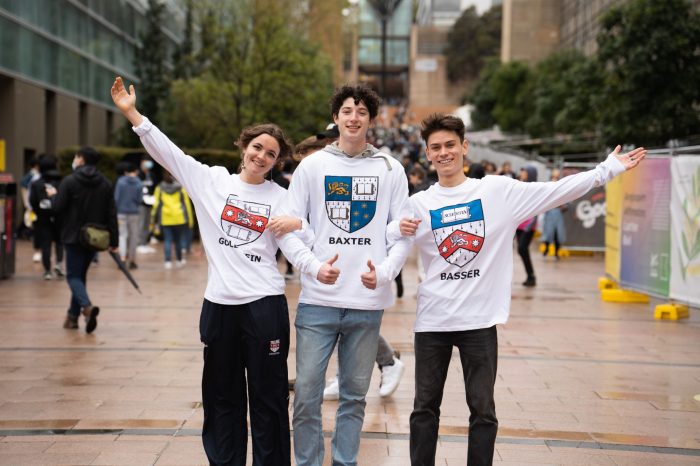 UNSW Accommodation people and events - Students representing, Goldstein, Baxter, and Basser Colleges with branded hoodies