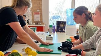 Alicia Dunning demonstrates safe cooking techniques at Galuma-li in Walgett