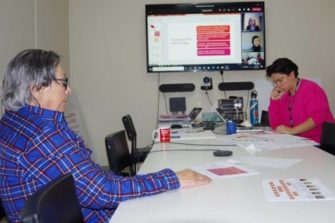 Peta and Virginia in a meeting room