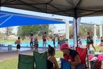 Peta MacGillivray surveying young people at Yuwaya Ngarra-li’s community data gathering at Walgett pool.