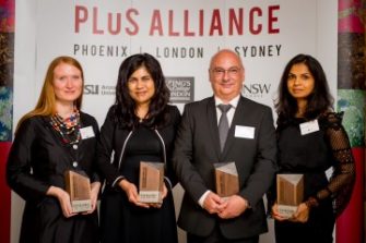 Photo of PLuS Alliance members winning an award