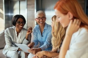 Photo of people discussing exciting things