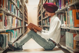 Man reading in library