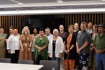 The Dharriwaa Elders Group and UNSW colleagues are smiling for the camera