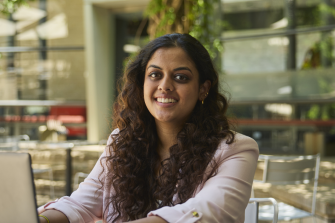AGSM students working together outside in the courtyard setting on campus