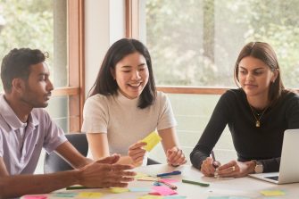 Student and career mentors talking in a meeting room at UNSW.