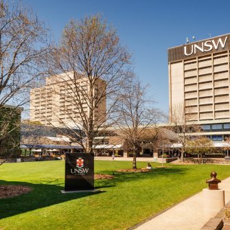 Students relaxing on Library lawn at Kensington UNSW.