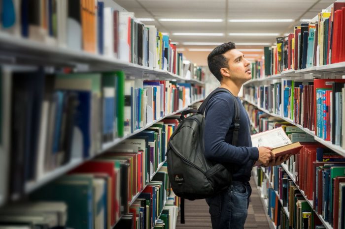 Student with books in library