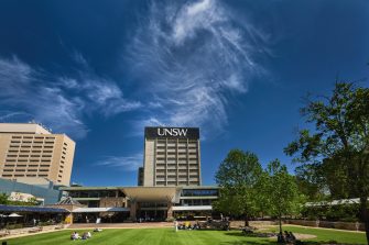 Students relaxing on Library lawn at Kensington UNSW.