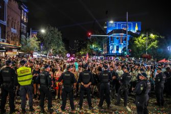 BYRON BAY, AUSTRALIA - JULY 22:  Police officers and drug detection dogs walk amongst festival goers before entering Splendour in the Grass 2016 on July 22, 2016 in Byron Bay, Australia.  (Photo by Mark Metcalfe/Getty Images)