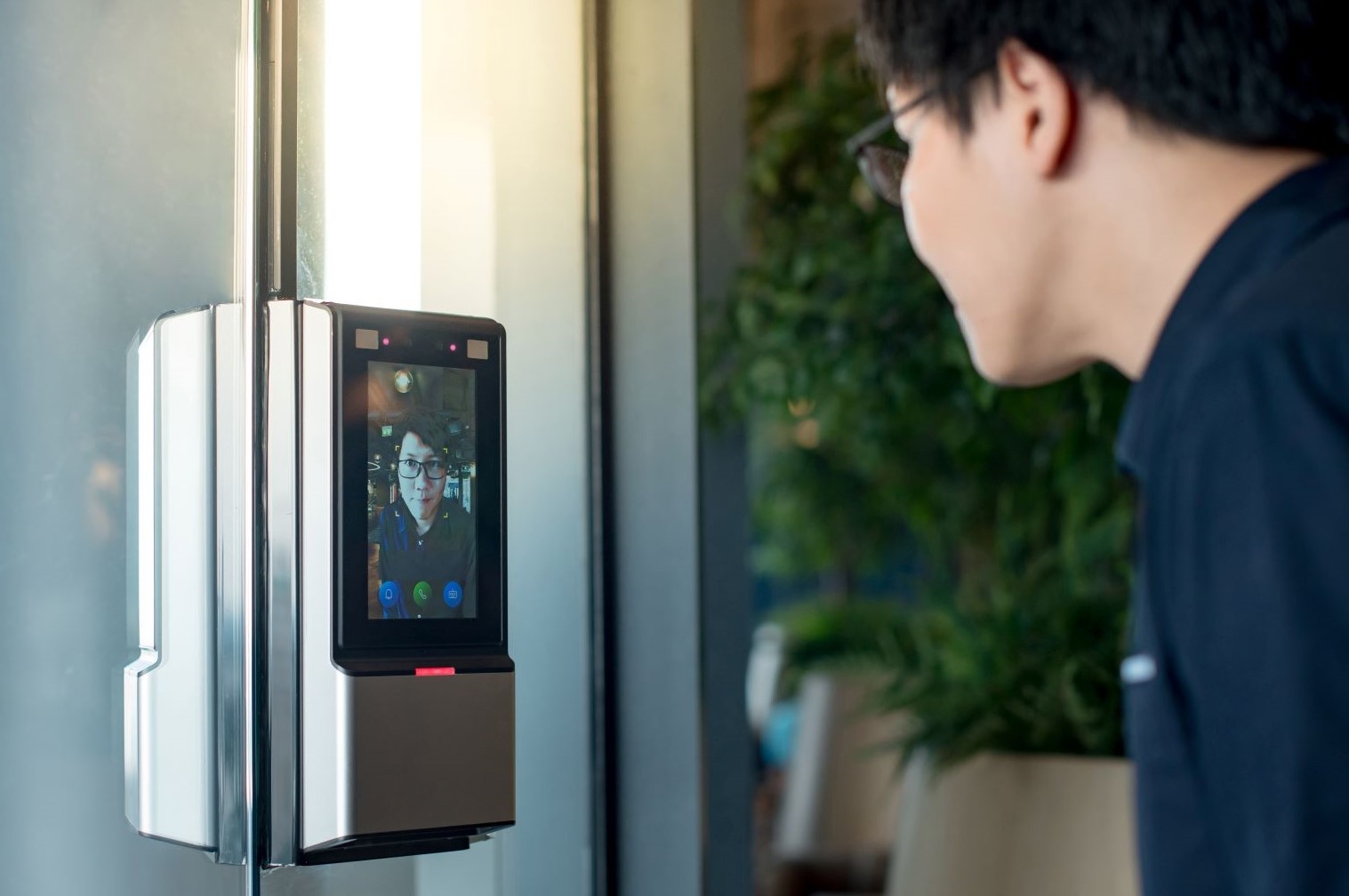 Man looking at face ID lock