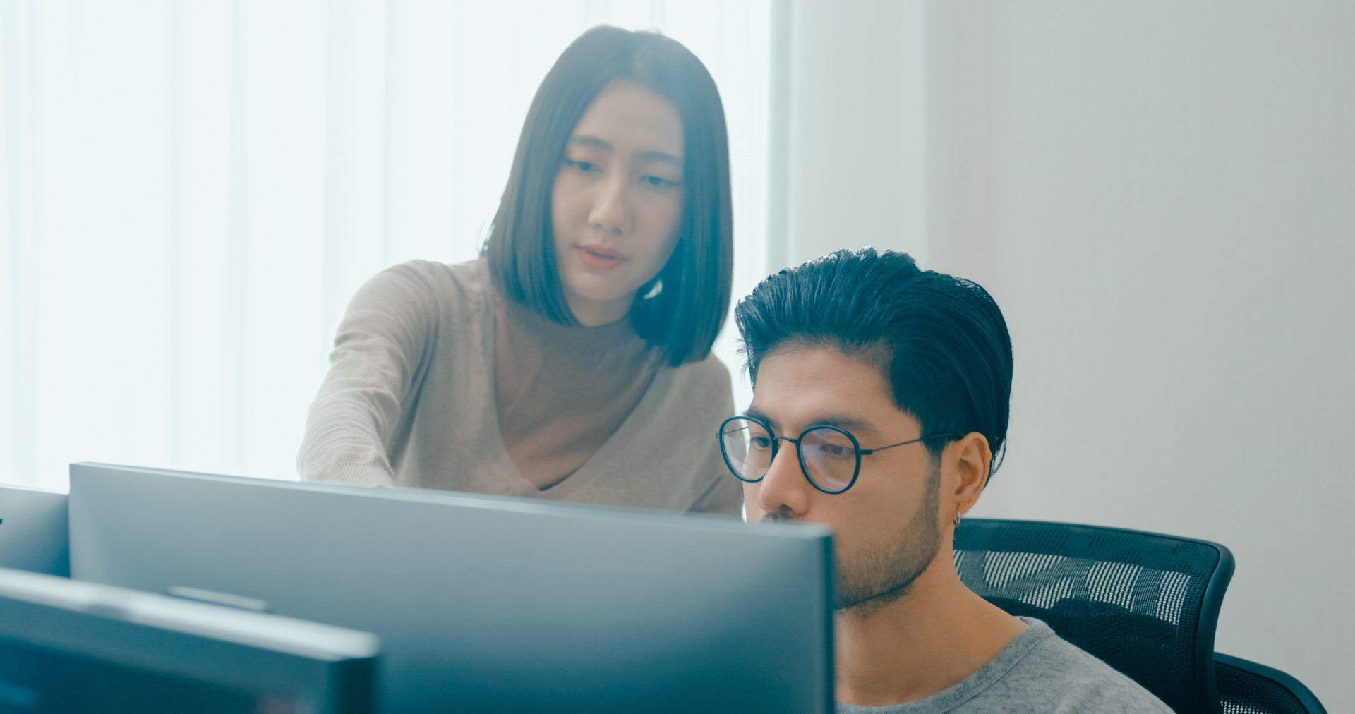 Group Adult Asia male, female freelance meeting write prompt AI bot IT app smart program nomad, video game, talk strategy, discuss plan, user interface, designer, big data center on desktop computer.