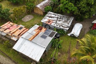 A composite photo of repairing an off-grid solar device