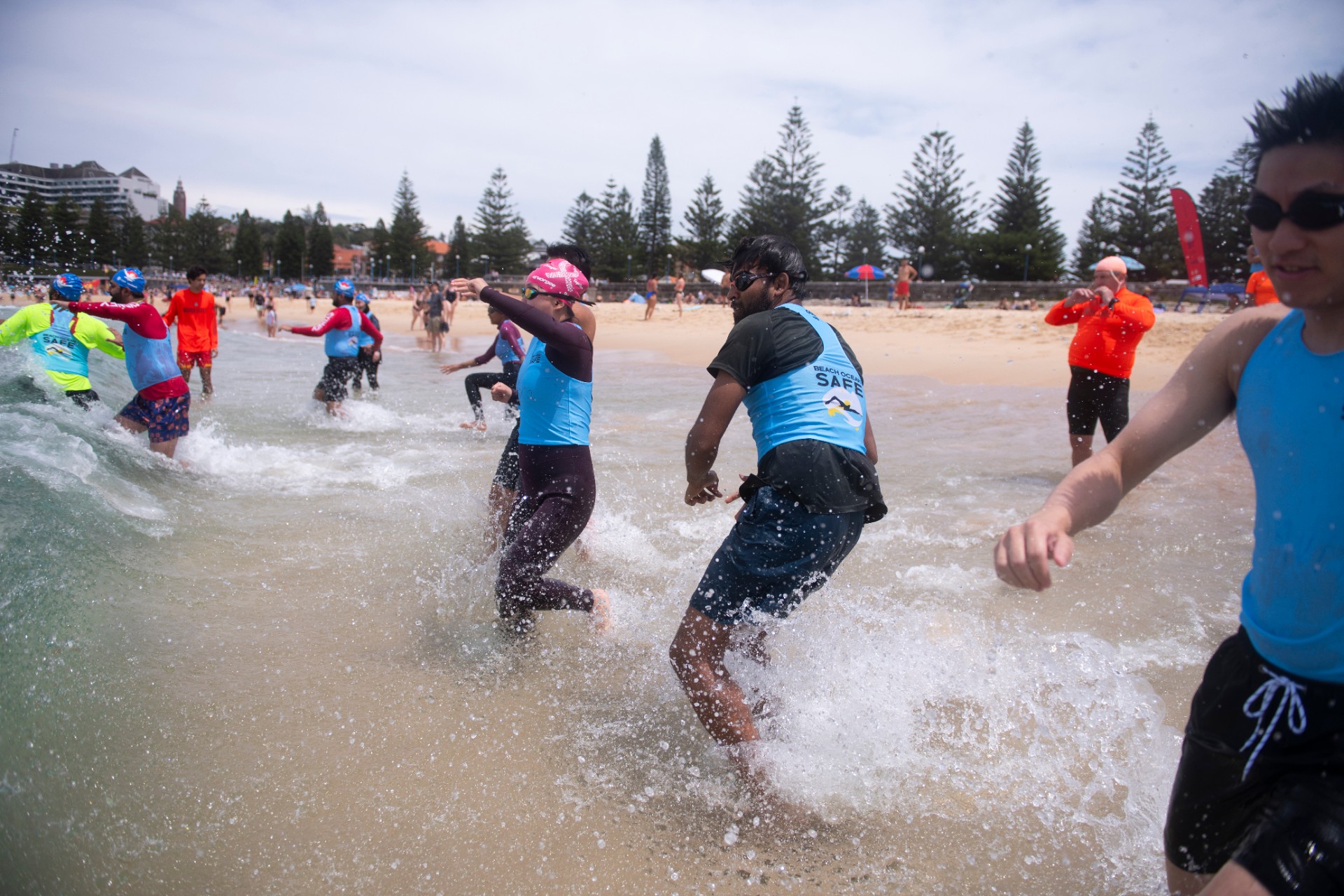 Group of young people in the waves at the beach