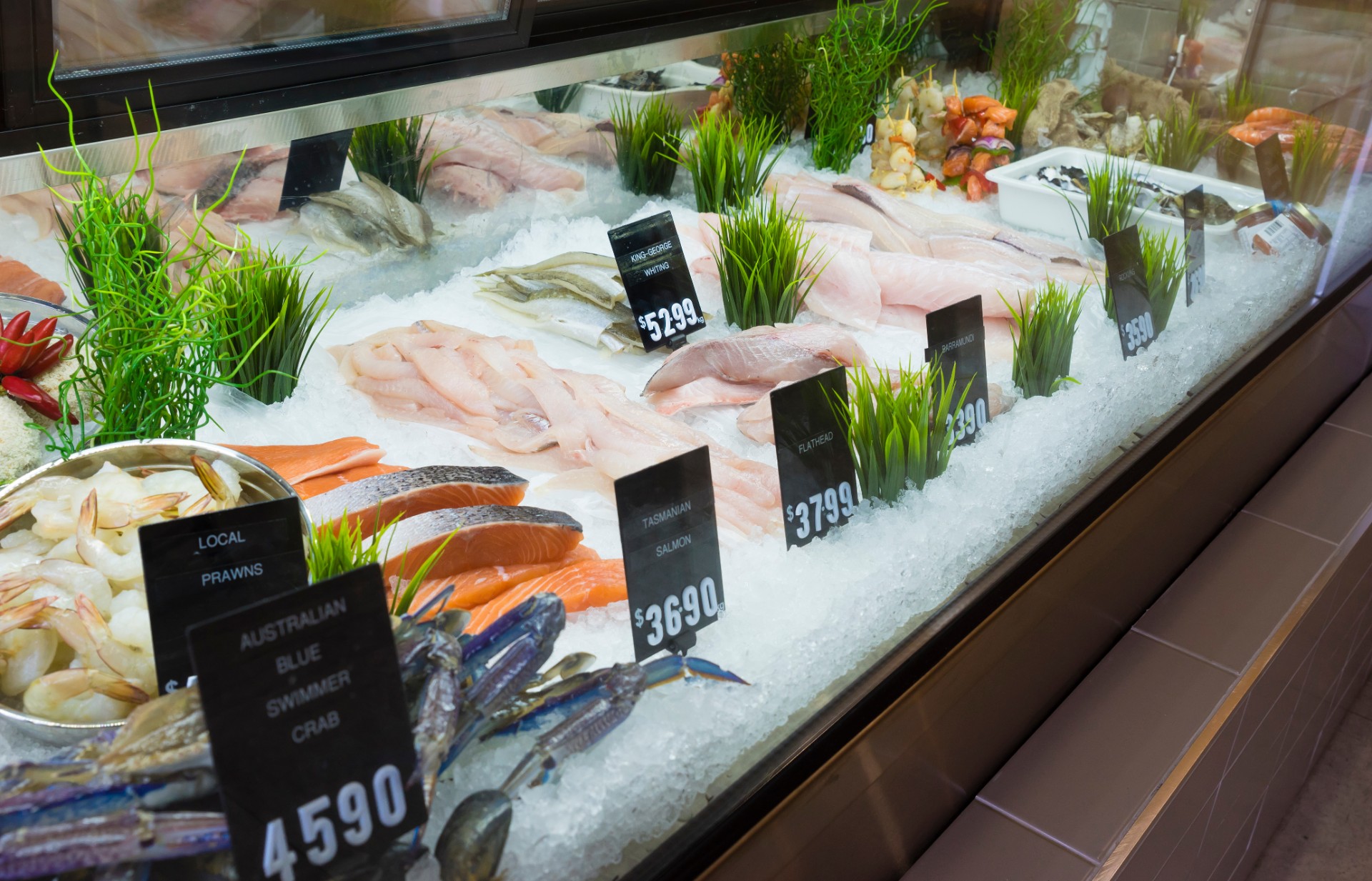 Display of seafood with price tags in a shop in Melbourne, Australia