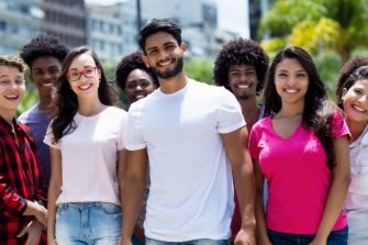 Youth of South America - Latin and hispanic and african american and caucasian young adults outdoor in summer in city