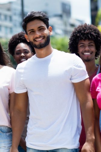 Youth of South America - Latin and hispanic and african american and caucasian young adults outdoor in summer in city
