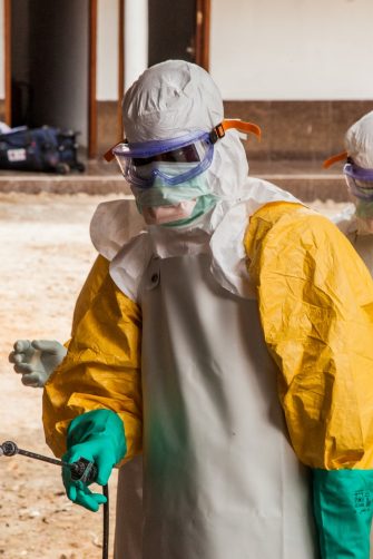 Two healthcare workers in protective gear