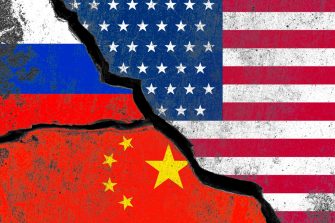 Russia  China and USA flag print screen on wall crack for military conflict and attack concept.