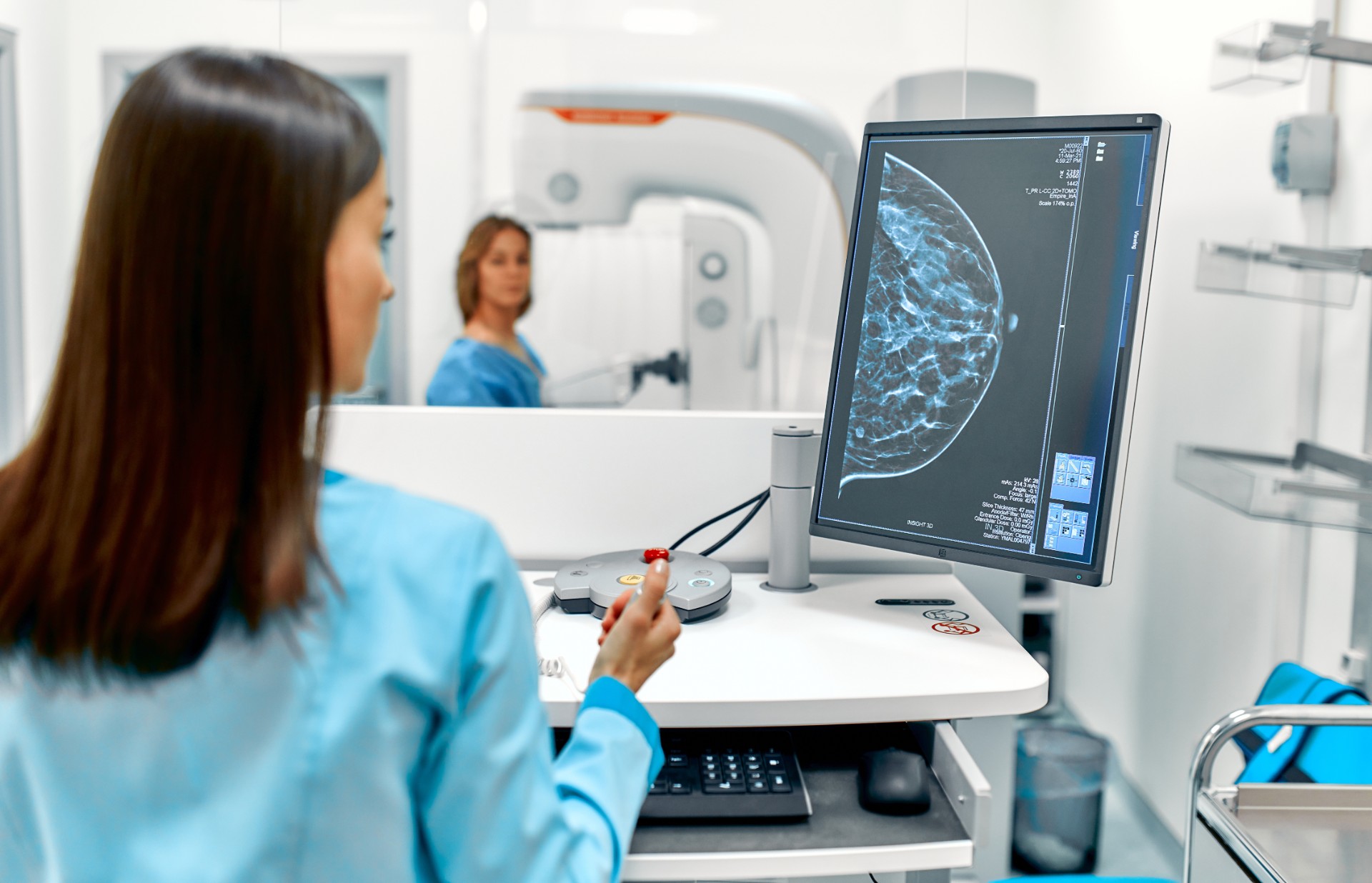 A woman undergoing a mammogram examination.