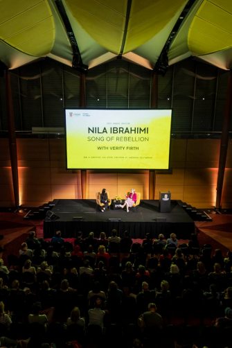 Nila Ibrahimi and Vice-President Societal Impact, Equity and Engagement Prof. Verity Firth on stage at the UNSW Gandhi Oration