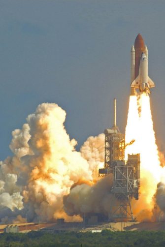 A space shuttle takes off.