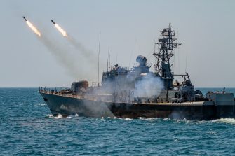 A warship firing missiles.