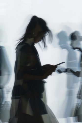 A couple of teenagers scrolling on their phones in claymation style. Generated by AI.