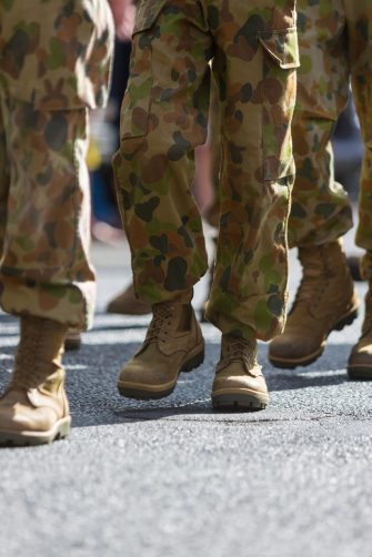 Close-up of the legs and boots of Australian soldiers marching