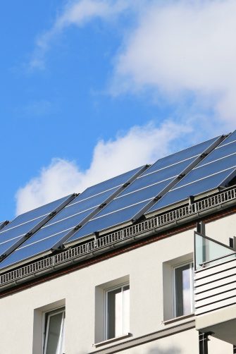 Solar panels on the roof of an apartment building in a residential district in Stockholm.
