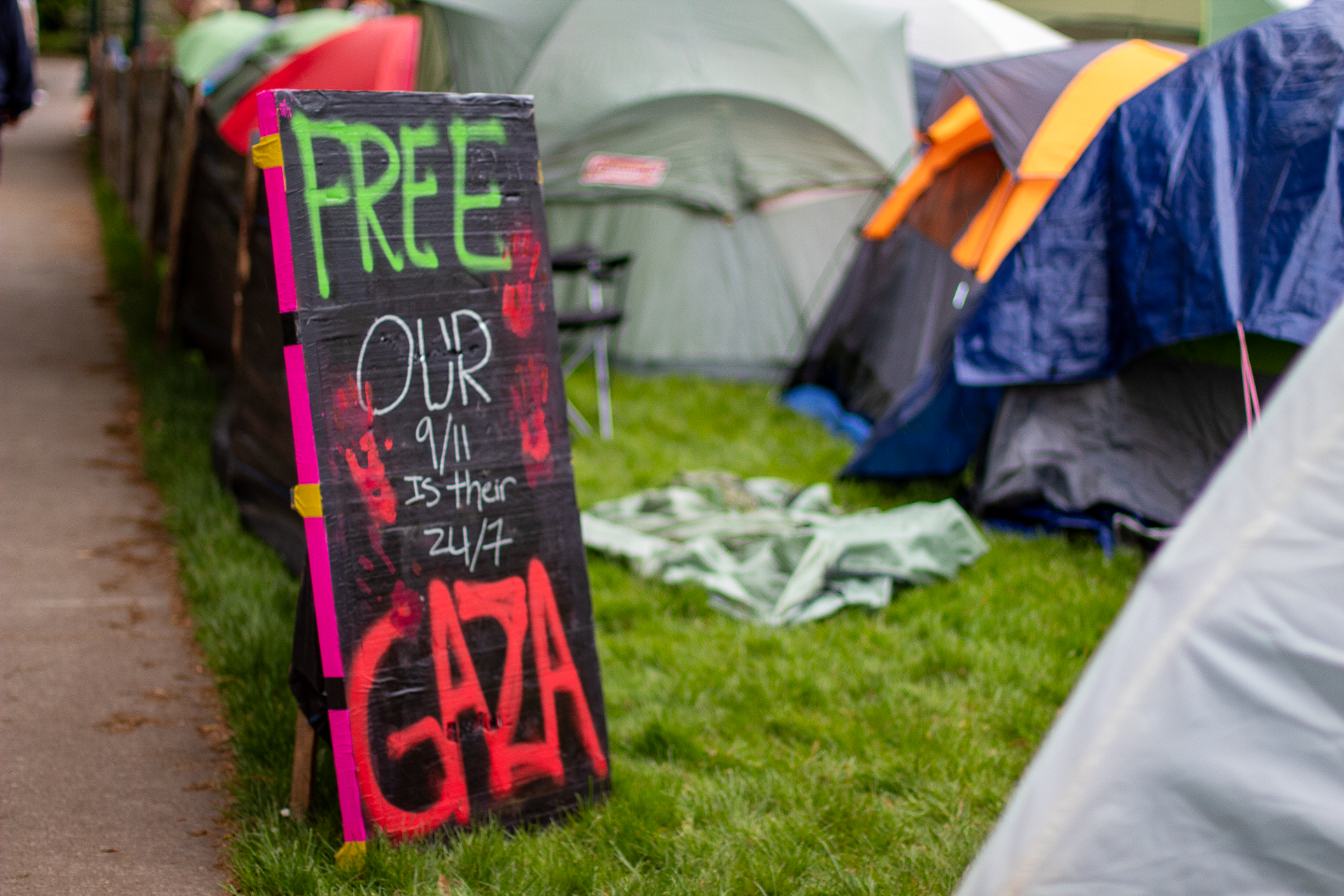 Protest sign at University of Oregon reading 'Free Gaza: our 9/11 is their 24/7'