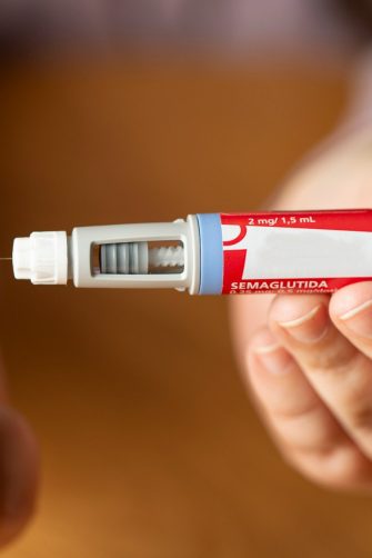 A person prepares to take semaglutide, a hormone that is used as a medication for improved blood sugar