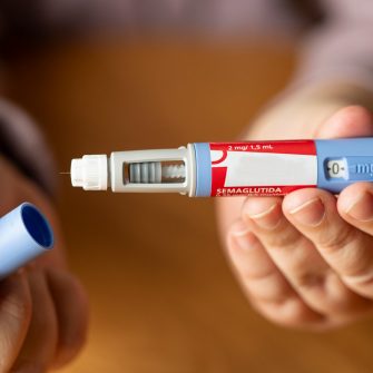 A person prepares to take semaglutide, a hormone that is used as a medication for improved blood sugar