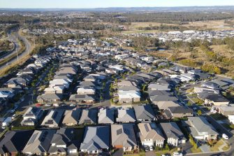 For lease sign on a blue display outside of a resedential building in Australia. Investment property real estate concept
