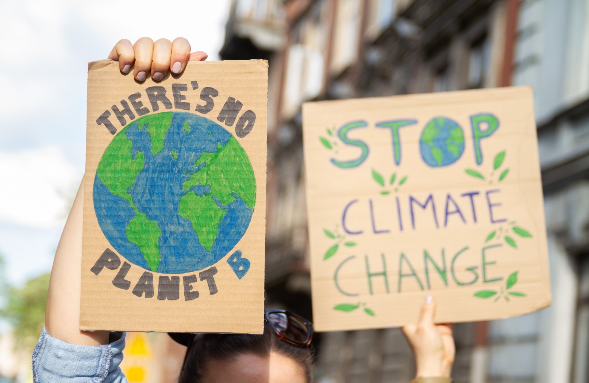 Signs says There's no planet B and Stop Climate Change