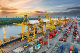 Aerial view container ship from sea port warehouse waiting for delivery containers shipment. Suitable use for transport or import export to global logistics concept.