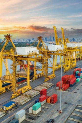 Aerial view container ship from sea port warehouse waiting for delivery containers shipment. Suitable use for transport or import export to global logistics concept.
