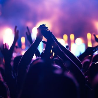 Crowd cheering at a concert music festival
