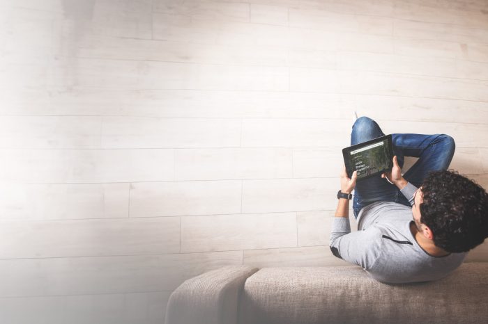 Photo of person from above browsing UNSW website on a tablet