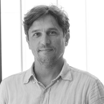 A black and white headshot of Dr Alessandro Bressan, who is a Lecturer at the UNSW Centre for Social Impact.