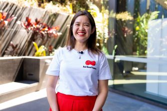 Gita smiling in Outdoor Patio Wearing Red Blood Comic Shirt