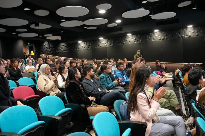 Audience members clapping at Circular Economy student pitch night