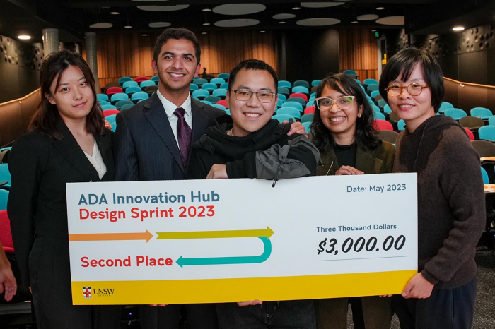 First place winning team from ADA Innovation Hub Design Sprint 2023 hold giant novelty cheque