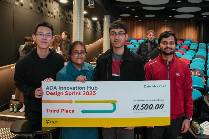 Third place winning team from ADA Innovation Hub Design Sprint 2023 hold giant novelty cheque