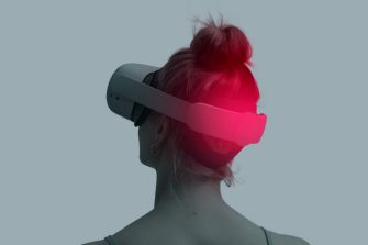 A women wearing a VR headset facing away from the camera 