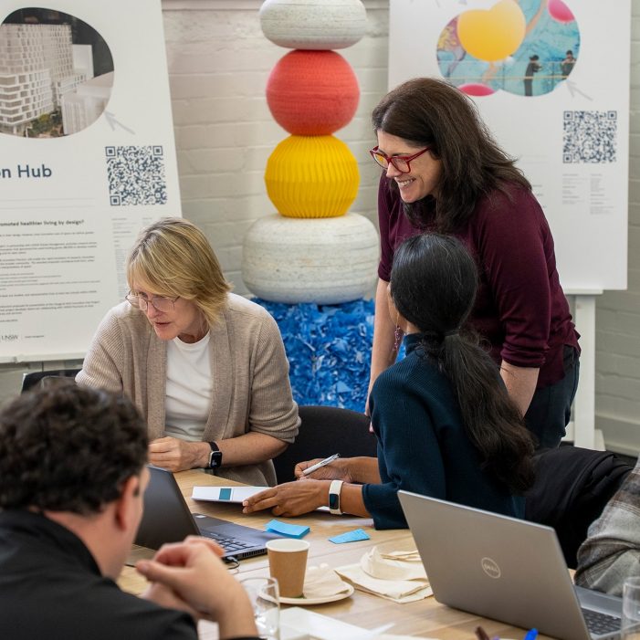 Dr Carly Vickers talking to participants during Project Coaching Program