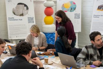Dr Carly Vickers talking to participants during Project Coaching Program