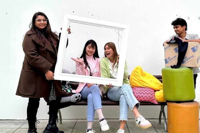 A group of students holding homewares 